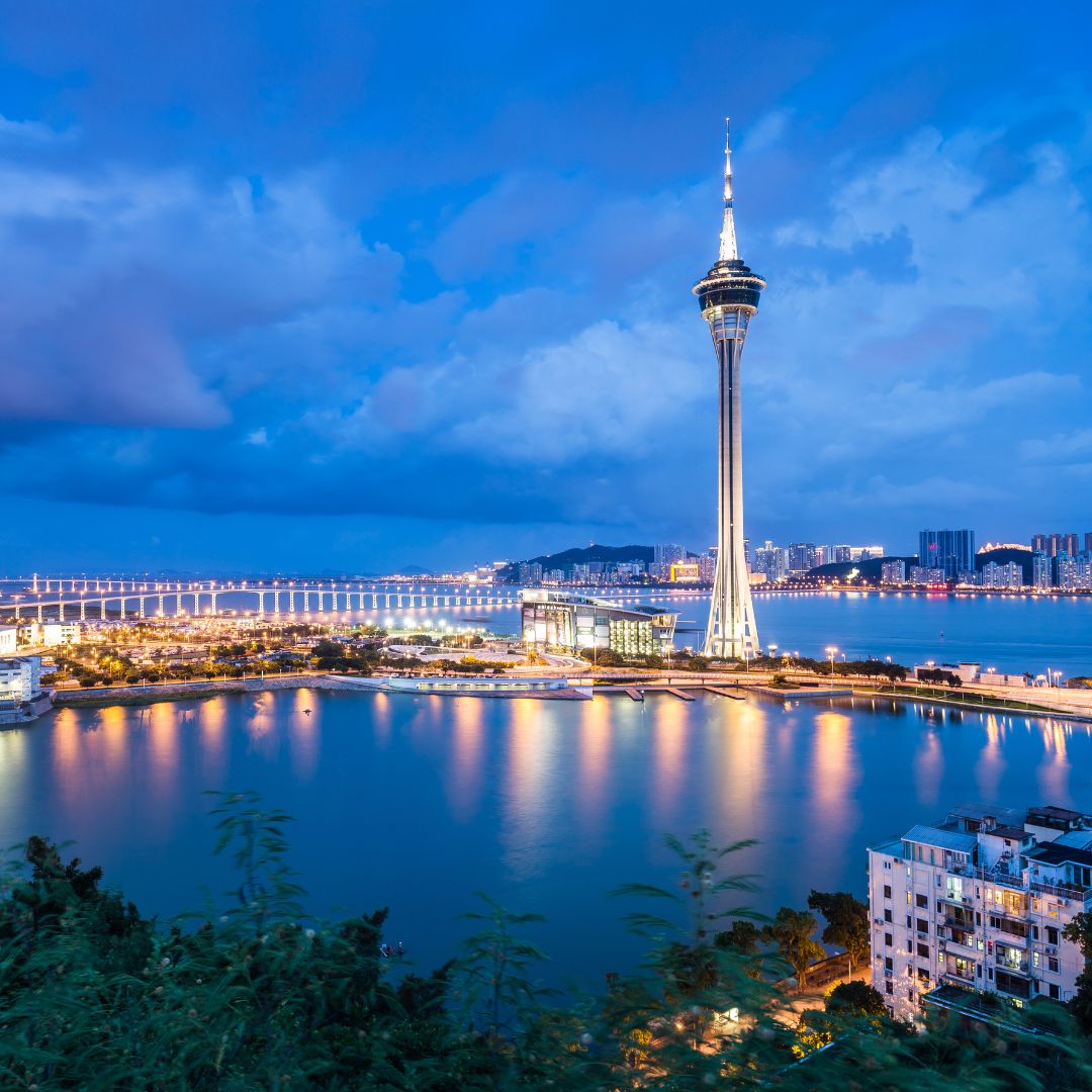 The Cotai resort strip of Macau lit up at dusk, with casinos and hotel towers, the world's leading gaming and integrated-resort destination for private jet charter.
