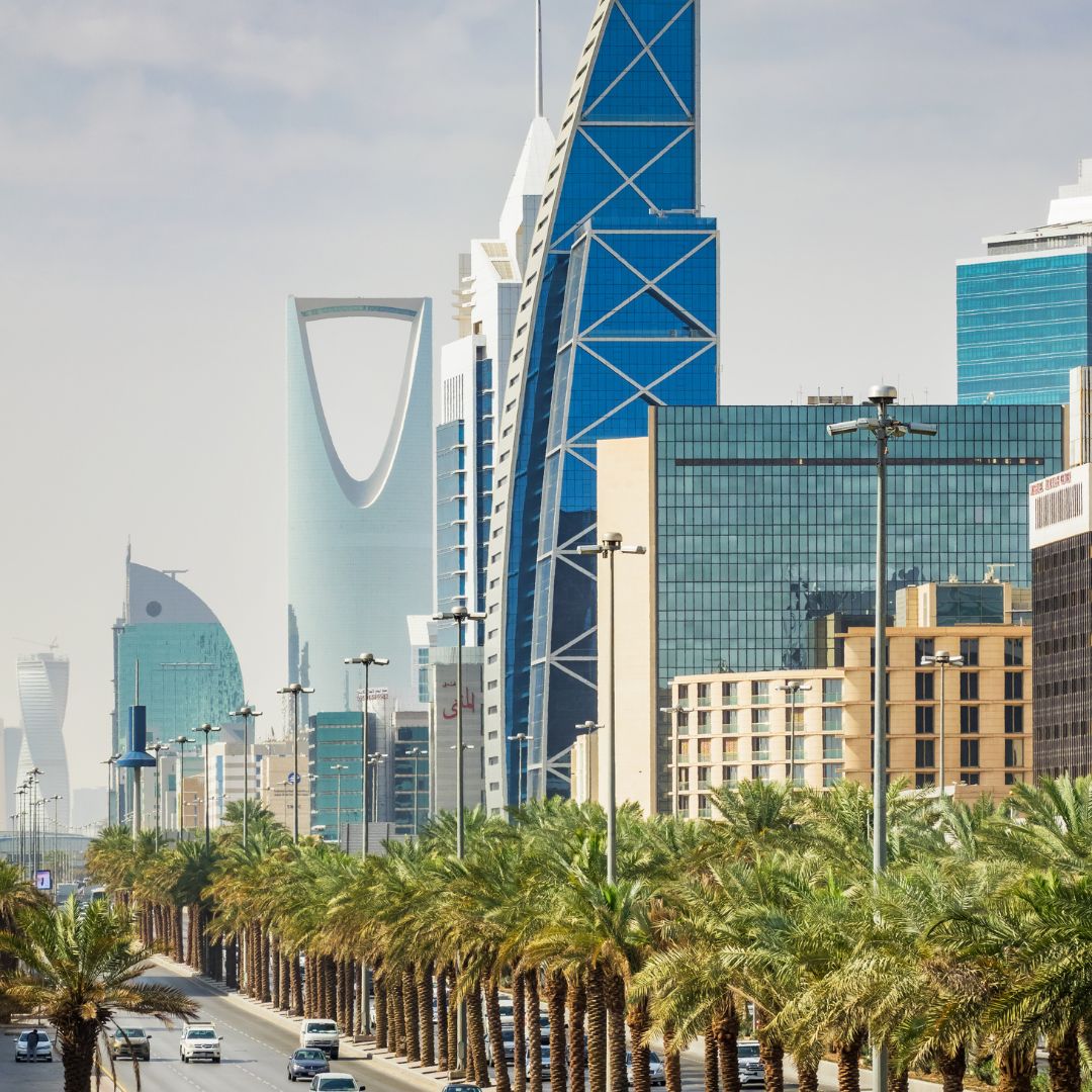 The Riyadh skyline at dusk, with the Kingdom Centre and the towers of the financial district rising above the Saudi capital, a fast-growing sovereign-wealth and business hub for private jet charter.